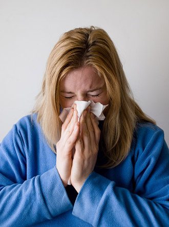 woman-blowing-nose