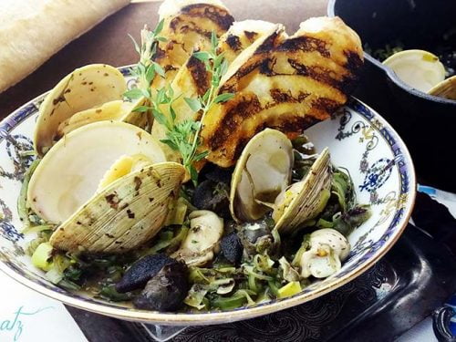 Sauteed Clams Oysters and Snails with Sea Greens